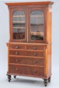 A VICTORIAN MAHOGANY BOOKCASE ON CHEST