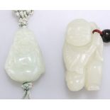 TWO CHINESE PALE CELADON JADE FIGURAL PENDANTS