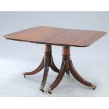 A GEORGE III STYLE MAHOGANY TWIN PEDESTAL DINING TABLE