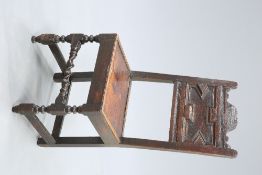 A 17TH CENTURY OAK PANEL-BACK CHAIR