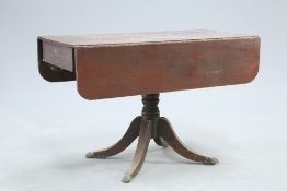 A REGENCY MAHOGANY DROPLEAF BREAKFAST TABLE