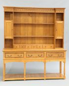 A GEORGIAN STYLE OAK DRESSER AND RACK