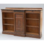 AN AESTHETIC MOVEMENT PARTIALLY EBONISED OAK BOOKCASE