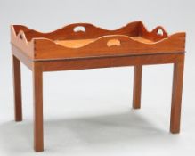 A GEORGE III STYLE MAHOGANY BUTLERS TRAY COFFEE TABLE