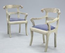 A PAIR OF SILVERED METAL ARMCHAIRS IN THE ANGLO-INDIAN STYLE