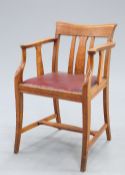 AN EDWARDIAN OAK DESK CHAIR