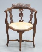 A LATE VICTORIAN CARVED WALNUT CORNER CHAIR