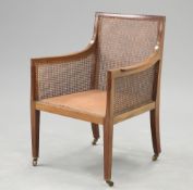 A 19TH CENTURY MAHOGANY AND CANEWORK BERGERE