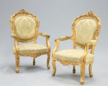 A PAIR LOUIS XV STYLE GILDED AND UPHOLSTERED FAUTEUILS