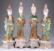 FOUR MING SANCAI GLAZED POTTERY FIGURES