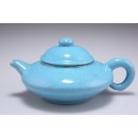 A CHINESE YIXING TURQUOISE CRACKLE GLAZED TEAPOT AND COVER
