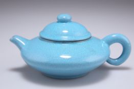 A CHINESE YIXING TURQUOISE CRACKLE GLAZED TEAPOT AND COVER