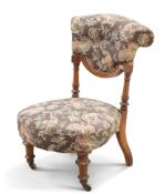 A VICTORIAN WALNUT AND UPHOLSTERED NURSING CHAIR, PROBABLY BY HOLLAND & SON