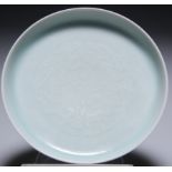 A SMALL CHINESE CELADON SAUCER DISH