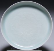 A SMALL CHINESE CELADON SAUCER DISH