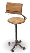 A VICTORIAN BURR WALNUT AND CAST IRON READING STAND