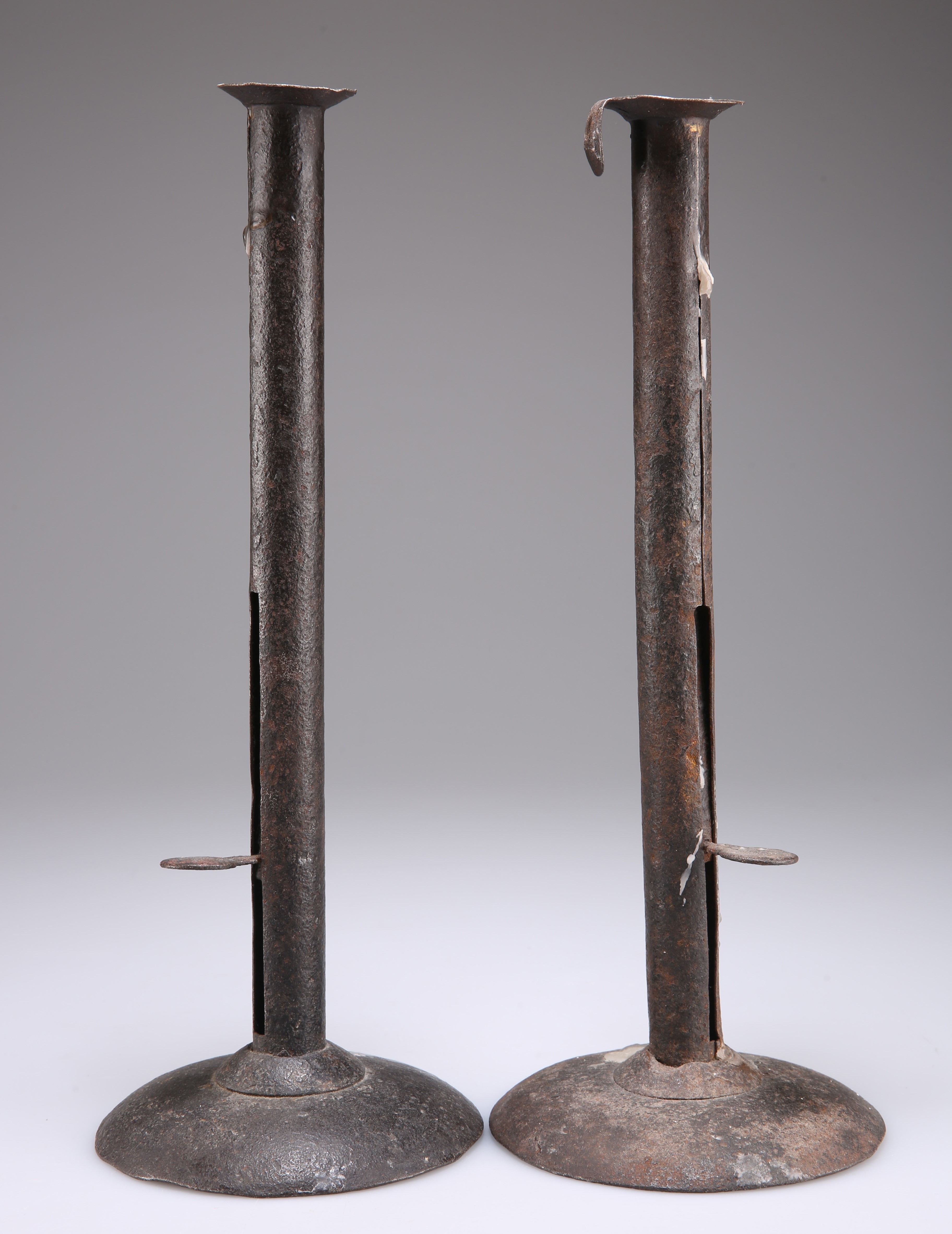 A PAIR OF EARLY 19TH CENTURY SHEET IRON CANDLESTICKS
