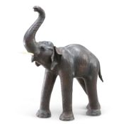 A LARGE VINTAGE LEATHER MODEL OF AN ELEPHANT