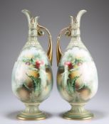 A LARGE PAIR OF PORCELAIN EWERS, CIRCA 1900