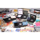 A LARGE COLLECTION OF ROYAL MINT AND OTHER COIN AND STAMP PACKS