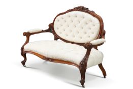 A VICTORIAN MAHOGANY AND UPHOLSTERED SETTEE