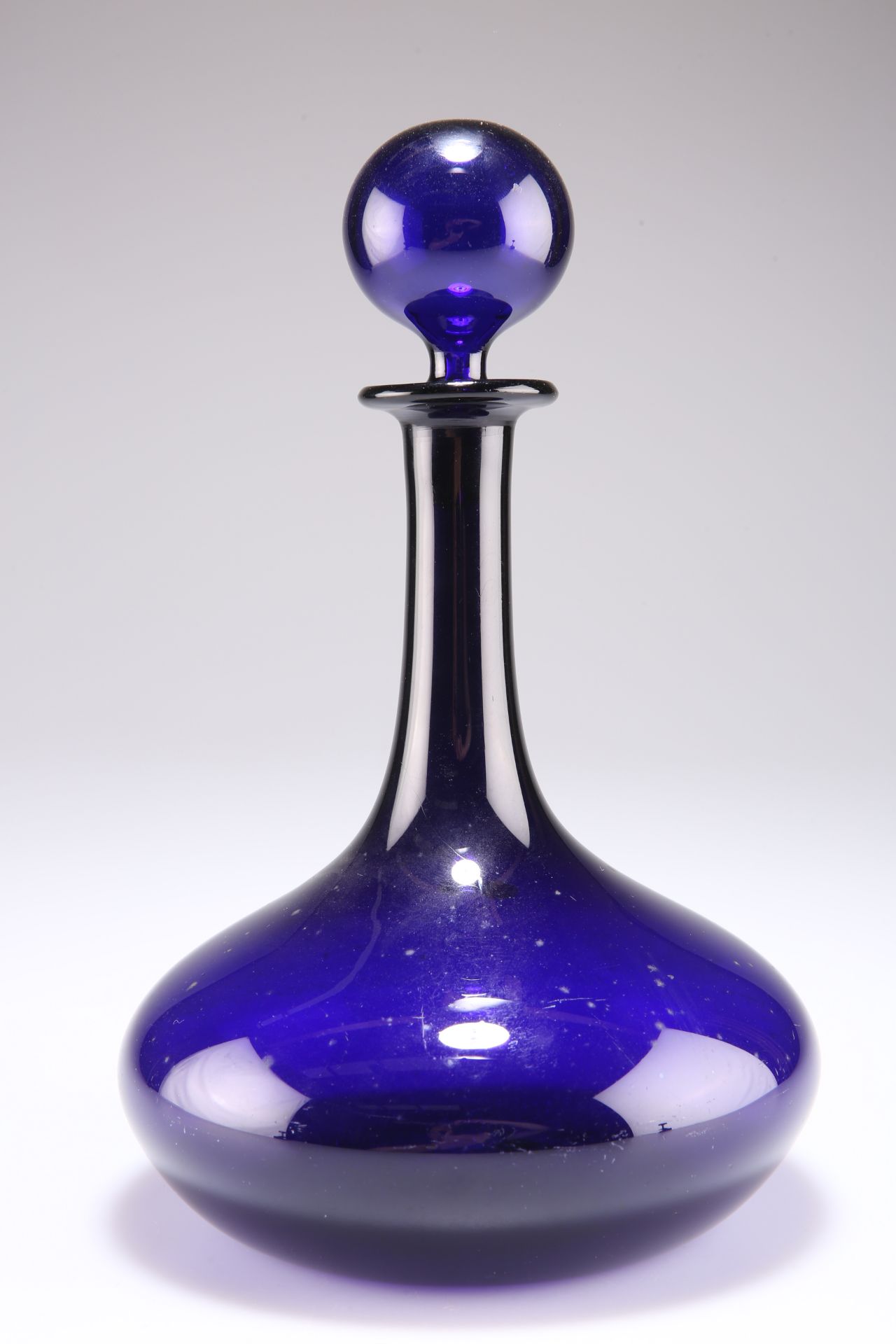 AN EARLY 19TH CENTURY BRISTOL BLUE GLASS DECANTER AND STOPPER