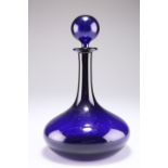 AN EARLY 19TH CENTURY BRISTOL BLUE GLASS DECANTER AND STOPPER