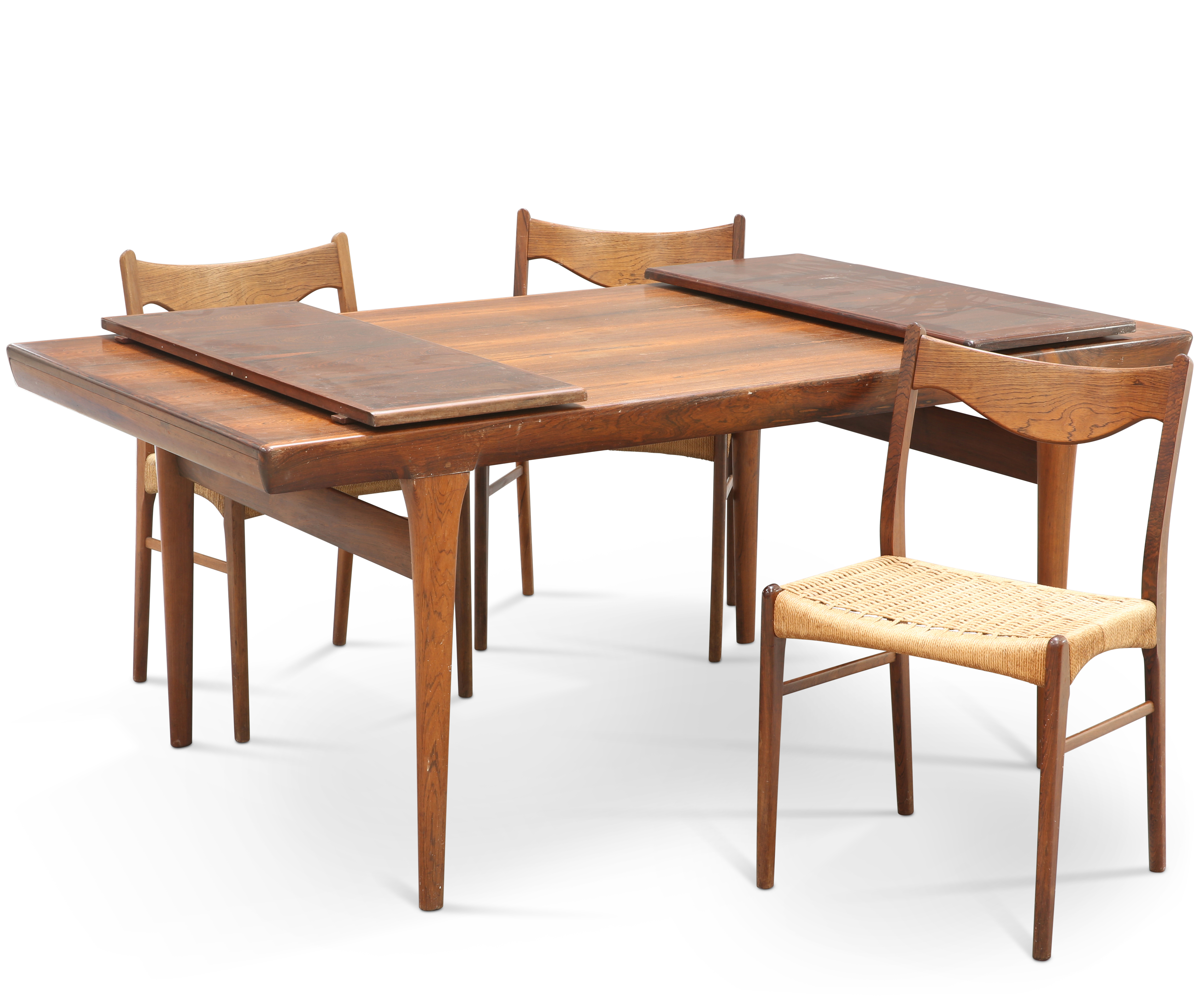 A DANISH ROSEWOOD EXTENDING DINING TABLE AND THREE CHAIRS
