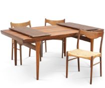 A DANISH ROSEWOOD EXTENDING DINING TABLE AND THREE CHAIRS