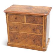 A VICTORIAN WALNUT MINIATURE CHEST OF DRAWERS