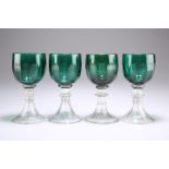 A SET OF FOUR EARLY 19TH CENTURY BRISTOL GREEN GLASS WINES