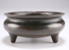 A CHINESE BRONZE TRIPOD CENSER