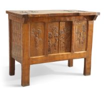 AN UNUSUAL ARTS AND CRAFTS OAK "HUNTING" CABINET