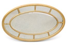 AN 18TH CENTURY STYLE GILT-GESSO OVAL MIRROR