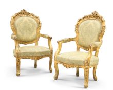 A PAIR OF LOUIS XV STYLE GILDED AND UPHOLSTERED FAUTEUILS