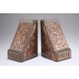 A PAIR OF ARTS AND CRAFTS COPPER AND BRASS-MOUNTED OAK BOOKENDS