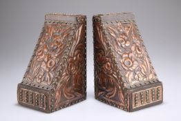 A PAIR OF ARTS AND CRAFTS COPPER AND BRASS-MOUNTED OAK BOOKENDS