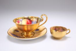 A ROYAL WORCESTER FRUIT PAINTED CUP AND SAUCER