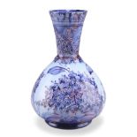 JAMES MACINTYRE & CO A "HESPERIAN LILAC" FLORIAN WARE VASE, DESIGNED BY WILLIAM MOORCROFT
