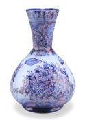 JAMES MACINTYRE & CO A "HESPERIAN LILAC" FLORIAN WARE VASE, DESIGNED BY WILLIAM MOORCROFT