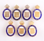 SEVEN GILT AND ENAMEL LAPEL BADGES, 'ON WAR SERVICE 1915'