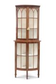 A GEORGE III STYLE MAHOGANY STANDING CORNER VITRINE