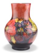 WALTER MOORCROFT AN ANEMONE PATTERN FLAMBÉ POTTERY VASE