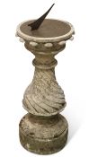 A STONE-MOUNTED BRASS SUNDIAL