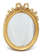 A 19TH CENTURY GILT-GESSO OVAL MIRROR