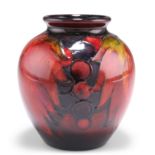 WILLIAM MOORCROFT A LEAVES AND BERRIES PATTERN FLAMBÉ POTTERY VASE