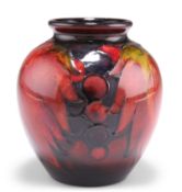 WILLIAM MOORCROFT A LEAVES AND BERRIES PATTERN FLAMBÉ POTTERY VASE