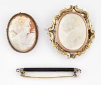 AN ONYX AND DIAMOND BAR BROOCH AND TWO CAMEO BROOCHES