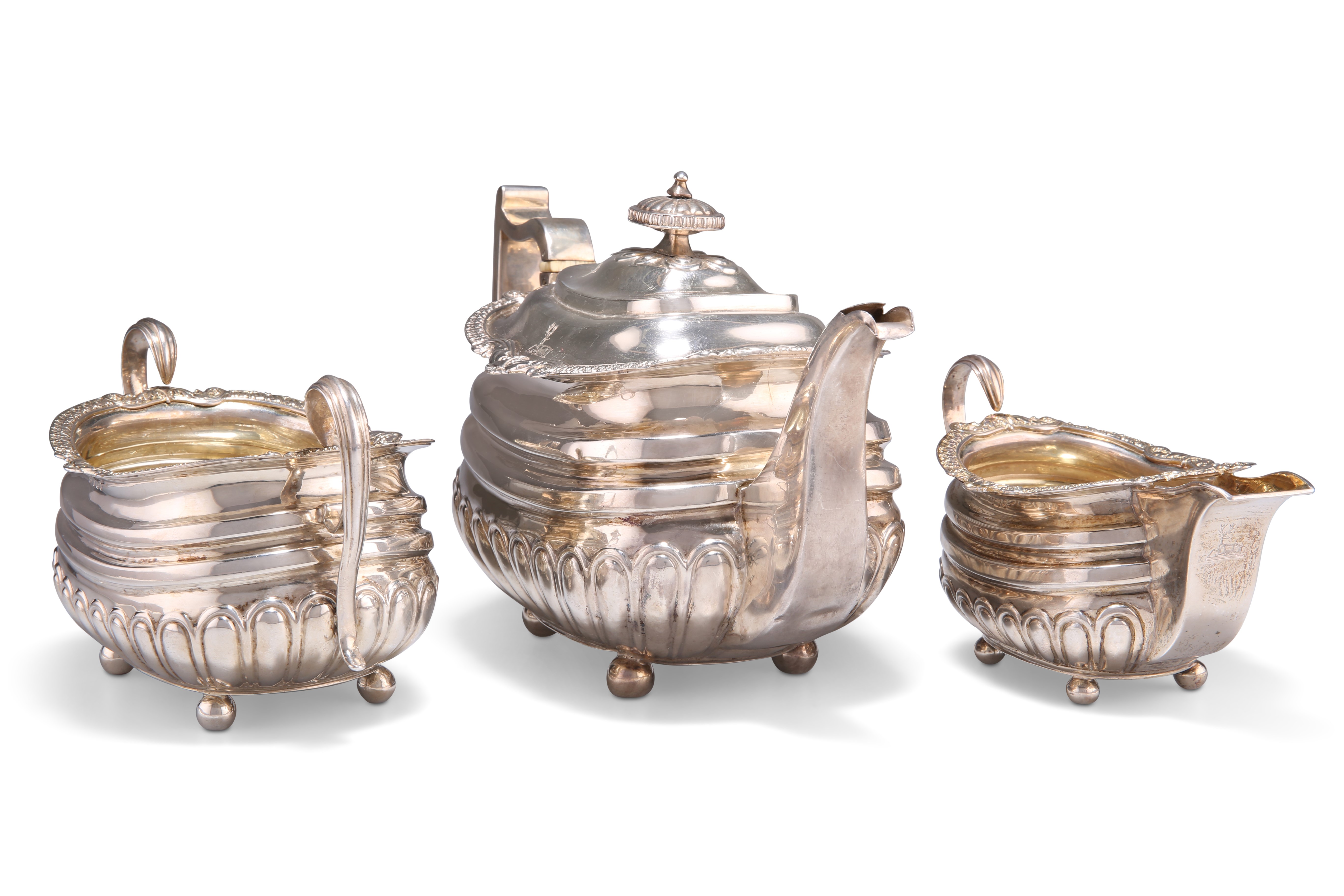 A GEORGE III SILVER THREE-PIECE TEA SERVICE