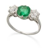 AN EMERALD AND DIAMOND THREE STONE RING